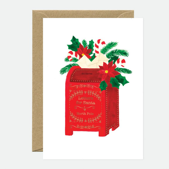 A Christmas greeting card featuring a red mailbox with gold foil details, adorned with festive decorations such as holly and candy canes, against a white background. A brown envelope is included.