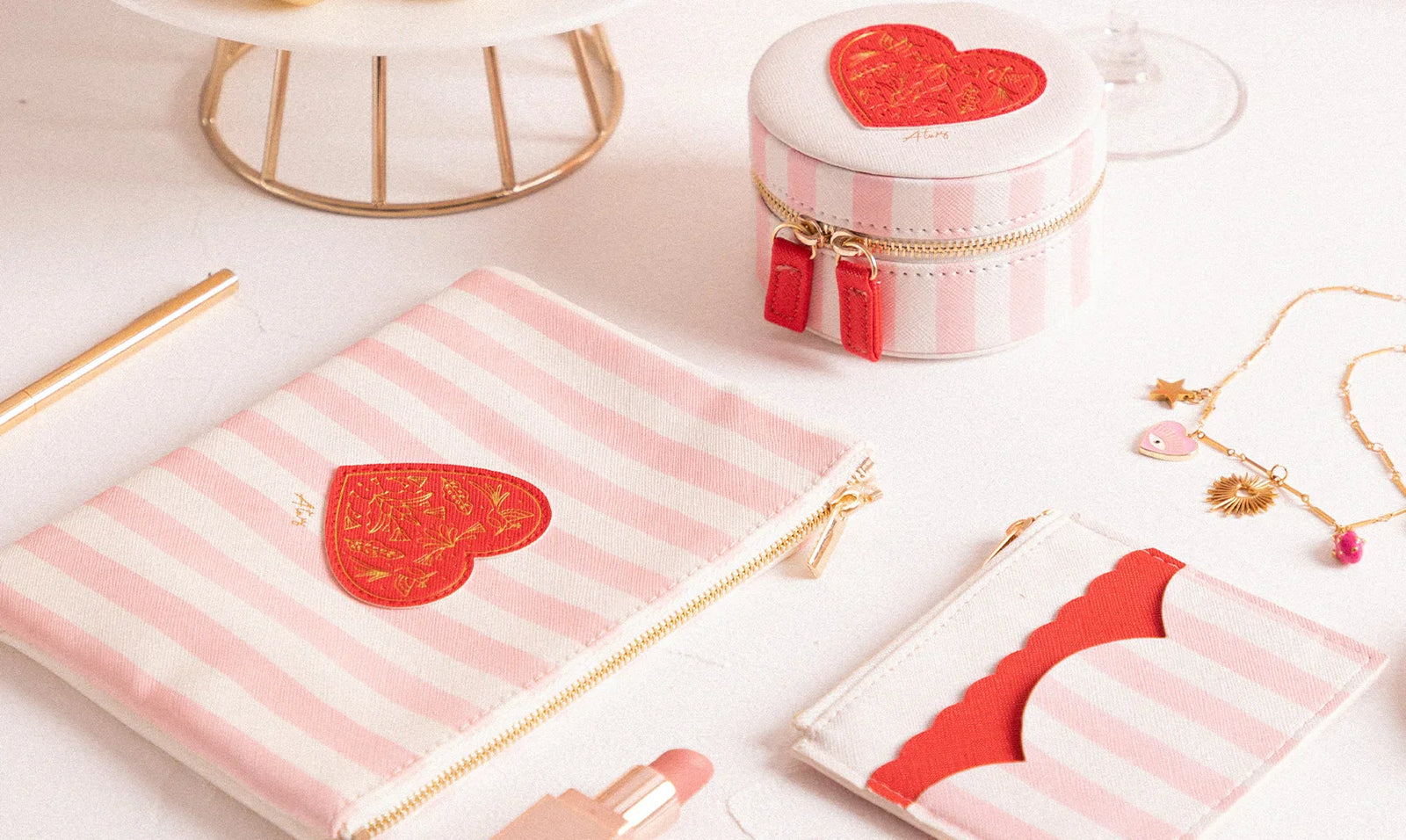 All the Ways to Say bags and accessories – pink striped pouches and jewelry cases with red heart design