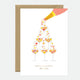 A greeting card featuring a floral champagne glass design with gold foil details, and a brown envelope.