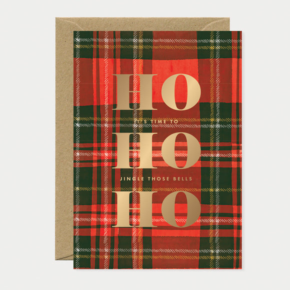 Greeting card with red and green tartan pattern featuring large gold foil “HO HO HO” text, perfect for Christmas celebrations.