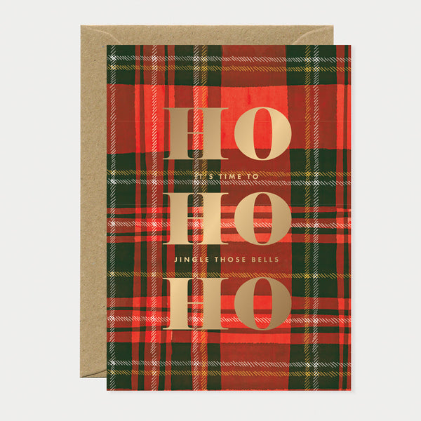 Greeting card with red and green tartan pattern featuring large gold foil “HO HO HO” text, perfect for Christmas celebrations.