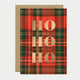 Greeting card with red and green tartan pattern featuring large gold foil “HO HO HO” text, perfect for Christmas celebrations.