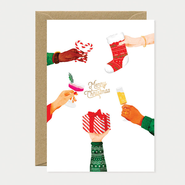 Greeting card with festive hands holding a gift, candy cane, stocking, and glasses of drinks around a “Merry Christmas” message in gold.