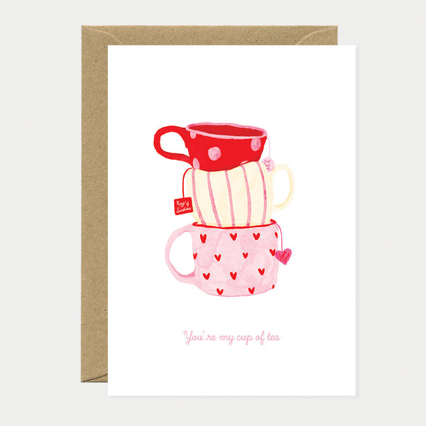 Greeting card with three stacked cups in red and pink, decorated with hearts and stripes, with the words "You’re my cup of tea".