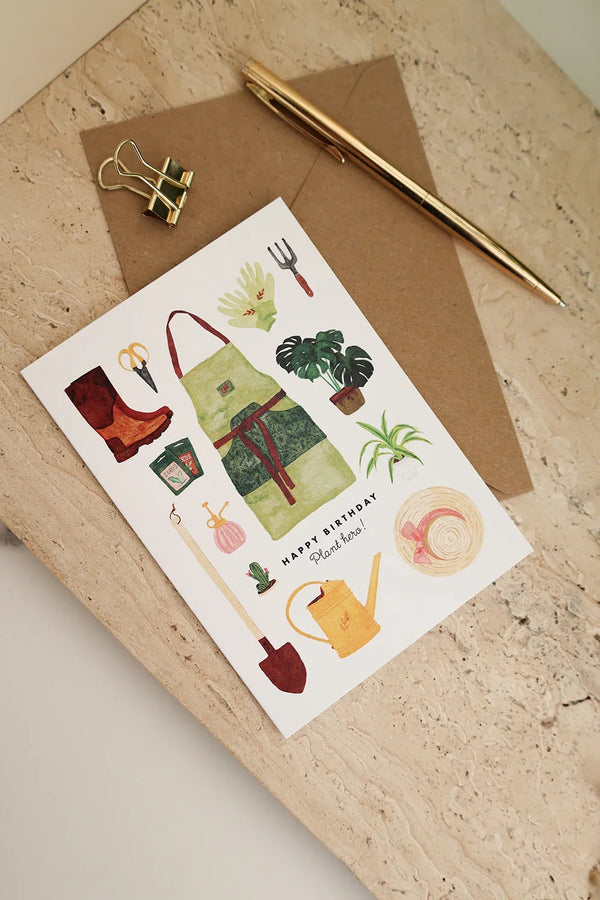 Birthday greeting card Plant Hero by All the Ways to Say with gardening tools, plants, and apron illustration. Illustrated birthday card with kraft envelope.