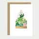Greeting card with tropical plant design and 'MERCI' text on a white background