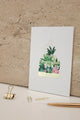 Merci greeting card Greenhouse by All the Ways to Say featuring a lush botanical greenhouse with gold foil details. Illustrated thank you card with kraft envelope.