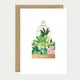 Greeting card with tropical plant design and 'MERCI' text on a white background