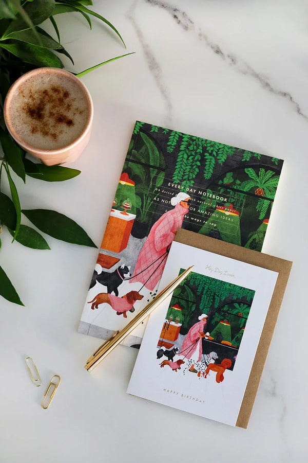 Hey Dog Lover birthday card with illustration of woman walking dogs, paired with matching notebook — artistic stationery by All the Ways to Say.