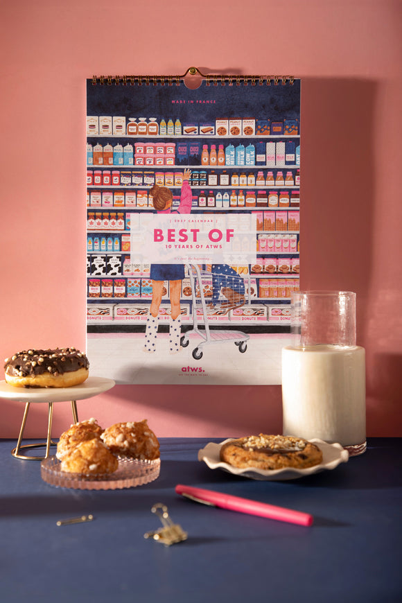 2027 Best Of wall calendar celebrating 10 years of ATWS, cover with a girl reaching for jam in a grocery store aisle