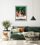 The Dog Sitter art print framed in a modern living room with green sofa and orange cushions