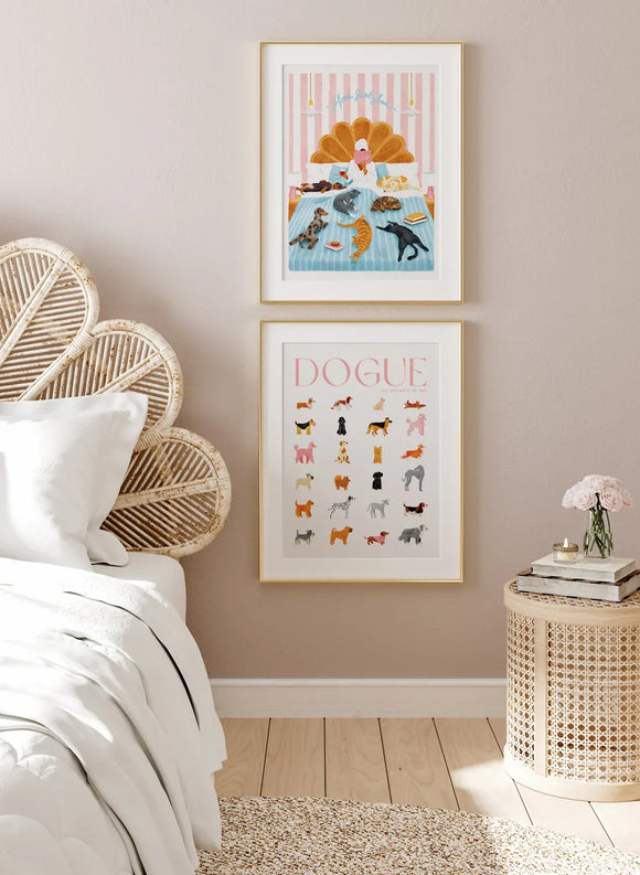 Dogue and Breakfast in Bed art prints framed above a rattan headboard in a cozy beige bedroom