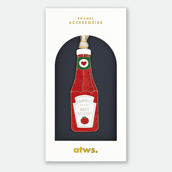 Santa’s Ketchup Ornament by All the Ways to Say shaped like a festive ketchup bottle, hand painted enamel holiday decoration.