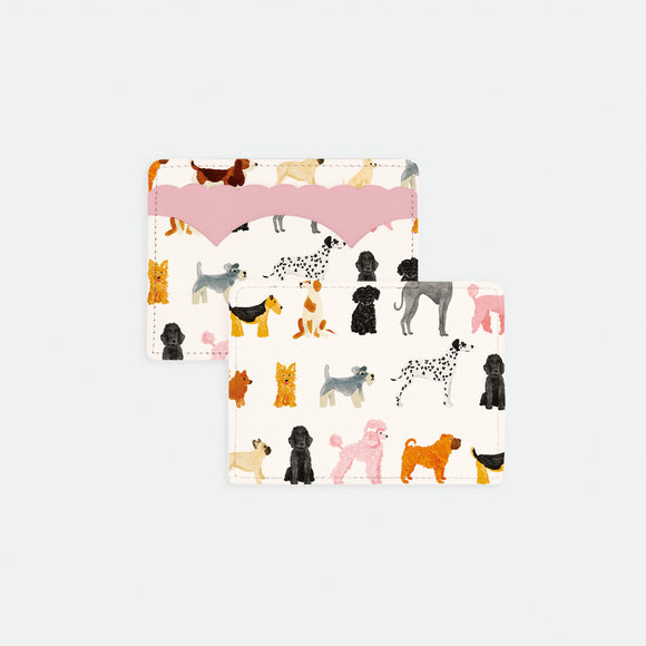Dog print card holder with colorful illustrated dog breeds on white background and pink scalloped leather detail.
