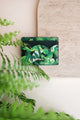 Green Cliff card holder featuring lush tropical leaf illustrations in various shades of green, eco-friendly vegan leather design.