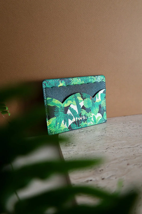 Close-up of the Green Cliff card holder with green foliage print, minimalist and durable card case made in vegan leather.