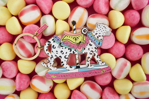 Wild Ride keychain by All The Ways To Say on colorful candy background – leopard carousel enamel design with gold details