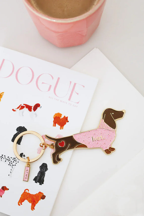 Dog keychain in dachshund shape with pink glitter sweater and gold details