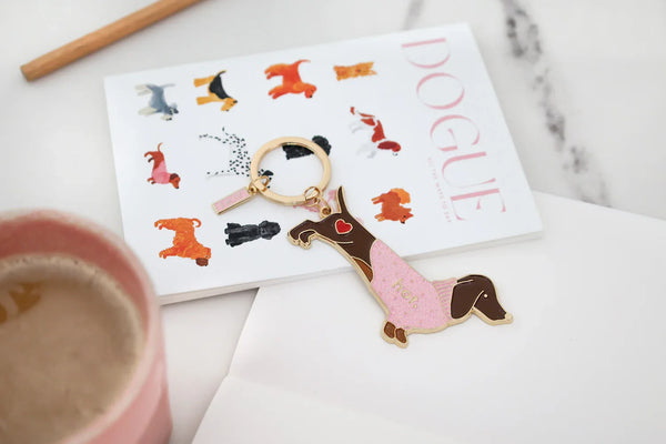 Close-up of Hot Dachshund keychain with gold-plated details and red heart accent