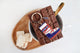 After Ski keychain by All The Ways To Say styled with chocolate bar and marshmallows on wooden tray