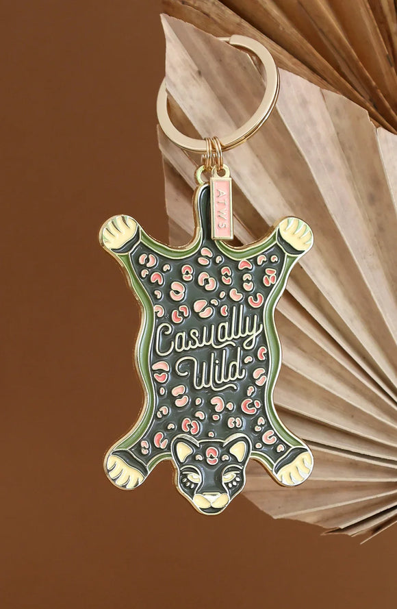 Close-up of Leopard Carpet keychain by All The Ways To Say with detailed enamel leopard and pink spots