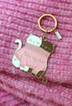 Close-up of 2 Cats in a Sweater keychain – enamel charm featuring two cats sharing a pink glitter sweater