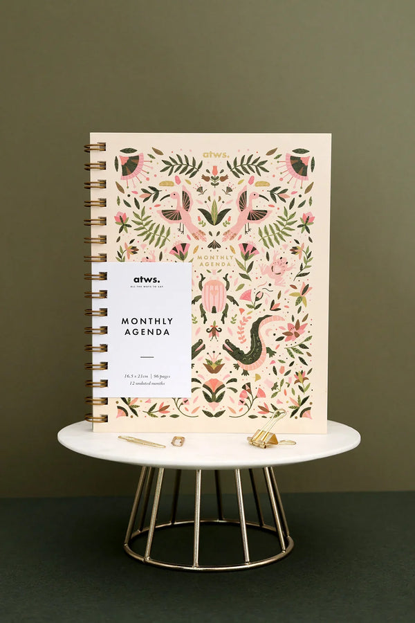 Full front view of Pink Croco monthly planner standing on display with cover design visible