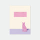 A5 notebook with a cover illustration of a lonely cat sitting on a floor with a pink and purple background. The text on the cover is minimalistic and poetic.