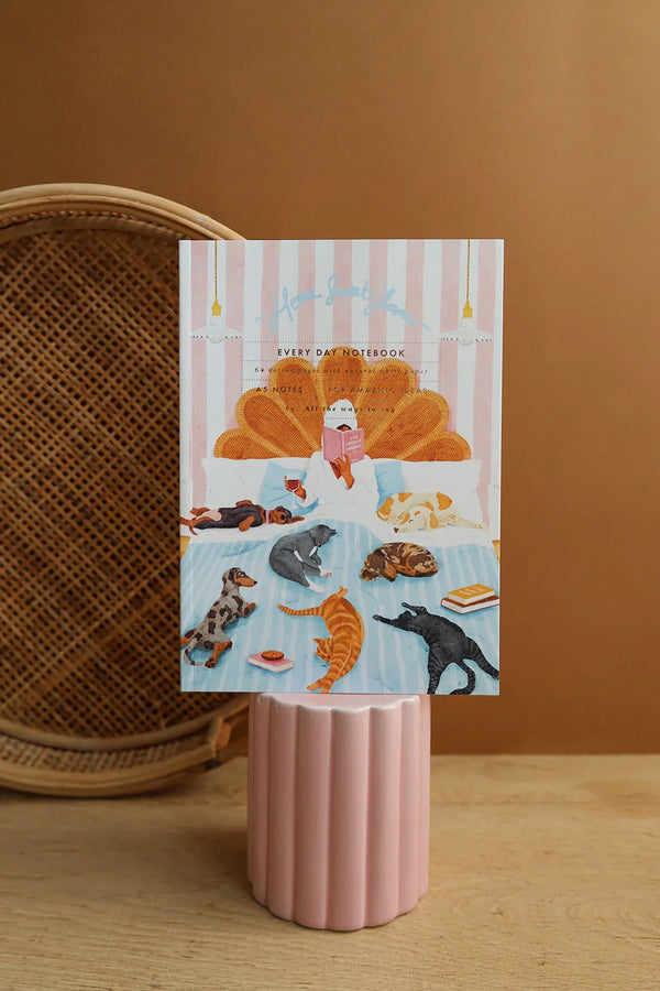 Home Sweet Home illustrated notebook by All The Ways To Say – pastel pink and orange design with sleeping pets and books
