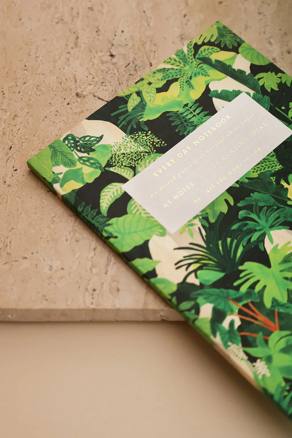 Tropical Green Cliff collection by All the Ways to Say showing notebook, greeting cards and jewellery box with botanical pattern on a warm brown backdrop.