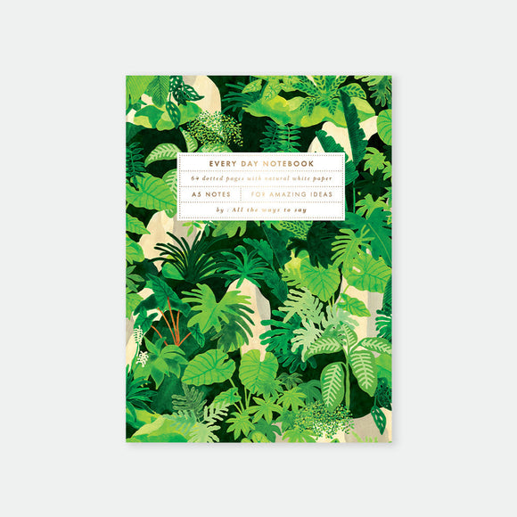 Notebook with green leaf pattern on a white background