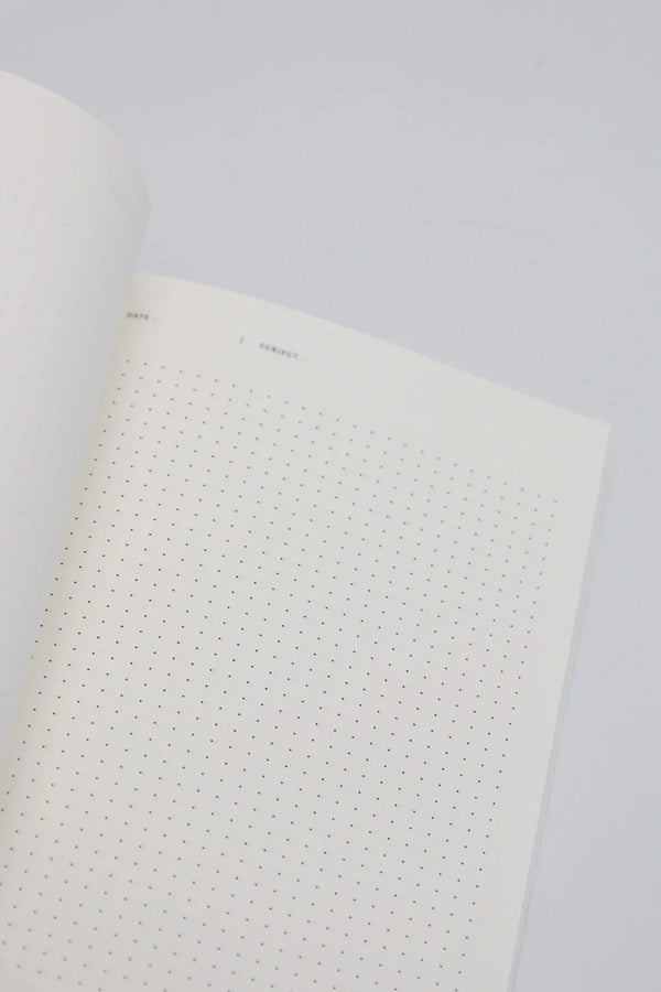 Open dotted notebook page with minimal design, showing clean white paper for writing and journaling.