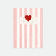 A5 sized notebook with pink and white stripes and gold foil details, featuring a heart emblem and text on the cover.