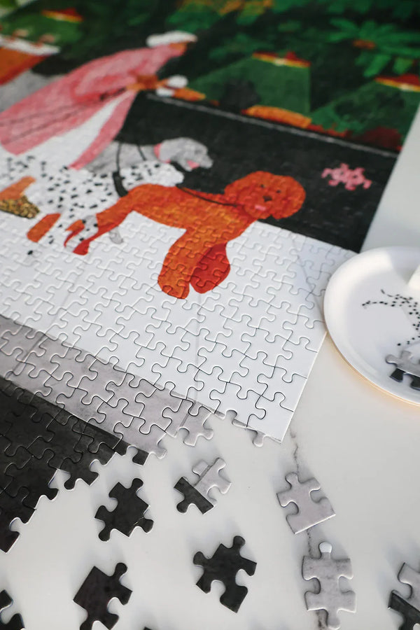 Box of The Dog Sitter puzzle by All the Ways to Say with a cup of coffee and leaves in the background.