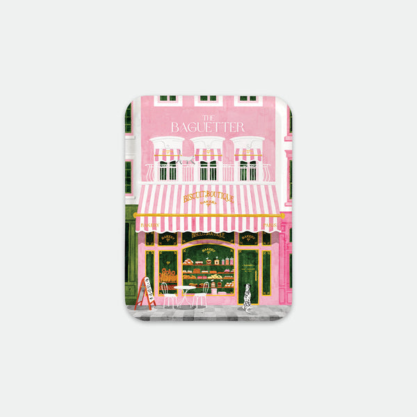 Rectangular breakfast tray with illustration of a pink Parisian bakery façade with striped awning, bread baskets and terrace, The Baguetter by All the Ways to Say