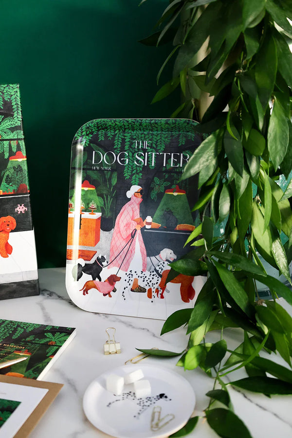 Decorative tray “The Dog Sitter” by All the Ways to Say, surrounded by greenery and styled with matching stationery on a marble surface.