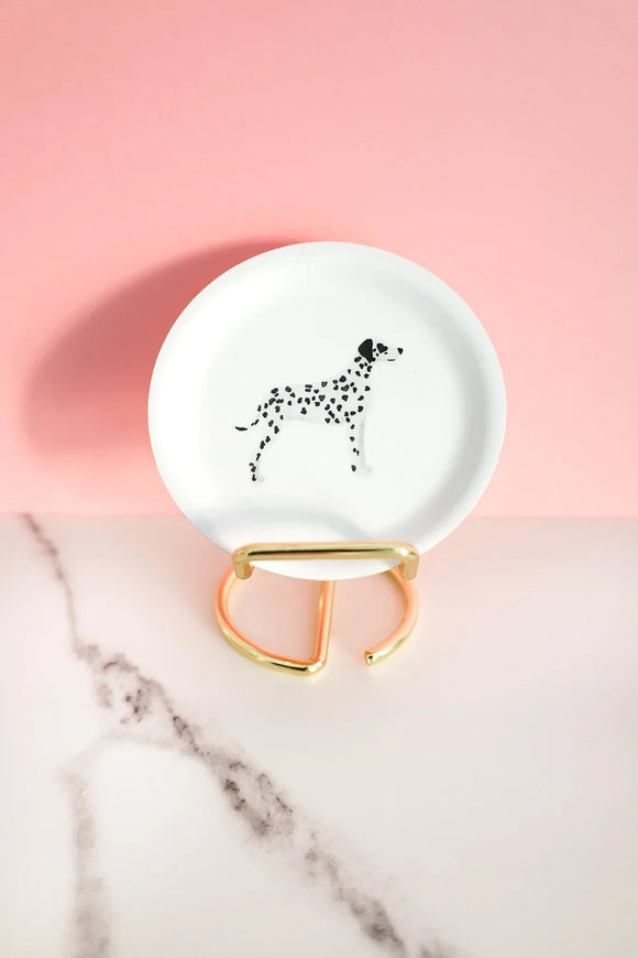 Mini tray with a black and white Dalmatian illustration, decorated with sugar cubes and gold paper clips on a marble surface — All the Ways to Say.
