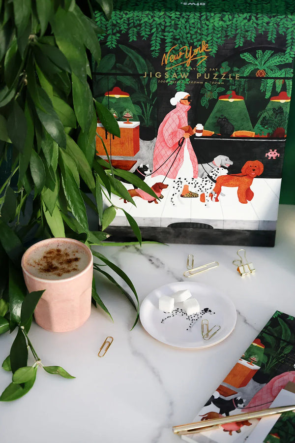 Elegant small tray displaying a Dalmatian design, presented on a gold stand against a pink background — All the Ways to Say.