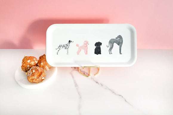 Rectangular white coffee tray with illustrations of four dogs against a pink background and marble surface.