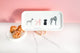 Rectangular white coffee tray with illustrations of four dogs against a pink background and marble surface.