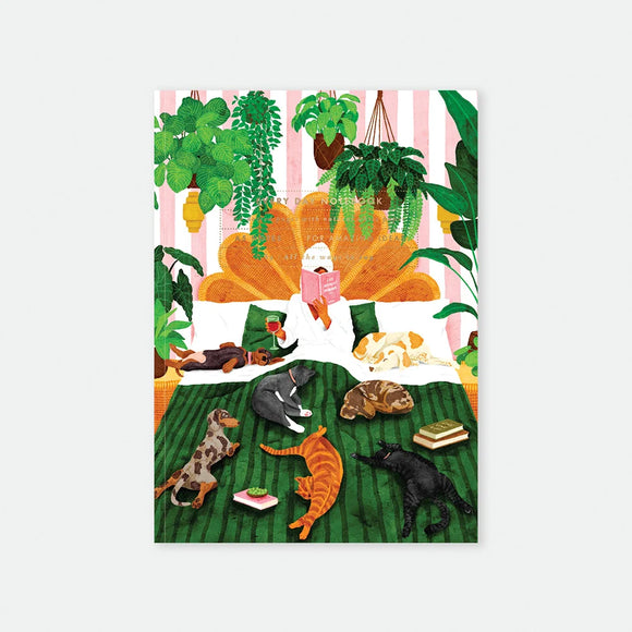 5 notebook cover by All The Ways To Say featuring a watercolor illustration of a person reading in bed surrounded by many pets and hanging plants.