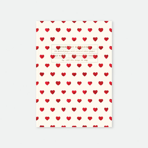 A5 notebook cover by All The Ways To Say featuring a repetitive pattern of small red watercolor hearts on a cream background.