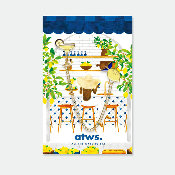 A gold enamel pin set featuring a margarita cocktail glass and a lemon connected by a gold chain, displayed on an Italian lemon bar illustration.