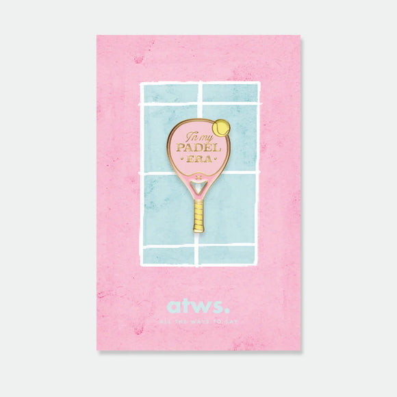 A pink padel racket enamel pin by All The Ways To Say with "In my Padel Era" gold text, displayed on a watercolor court-themed card.