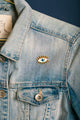 Close-up of the Blue Eye Enamel Pin with gold finish