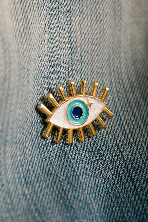 Blue Eye Enamel Pin worn on a classic denim jacket