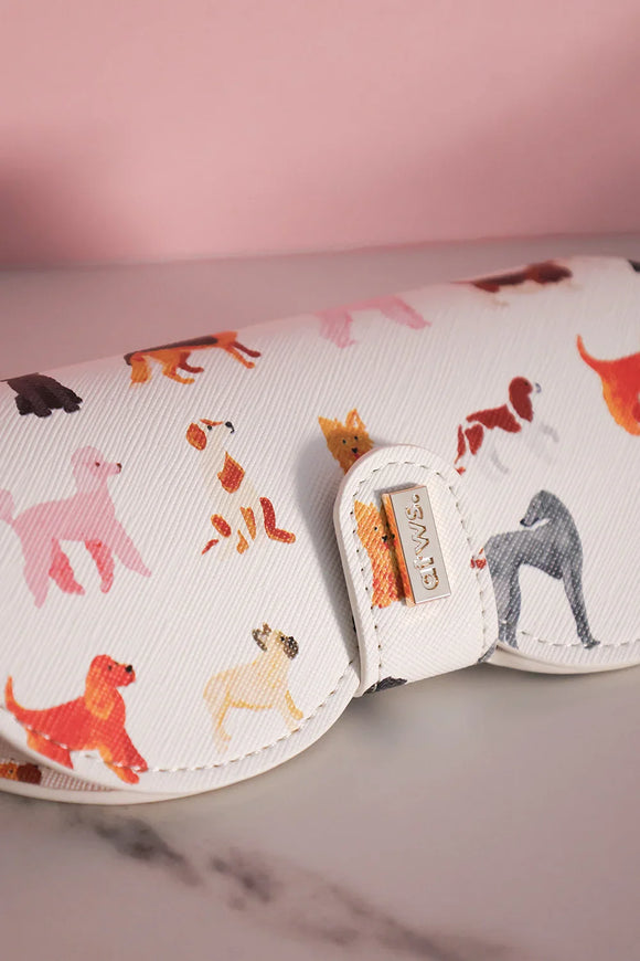 Glasses case with multicolored dog illustrations and gold atws. logo on clasp.