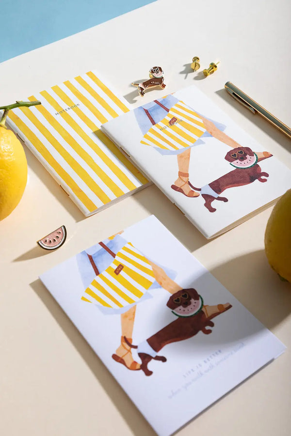 Summer Dachshund - Collection: a flat lay of notebooks featuring dachshunds with watermelon glasses and yellow stripes.