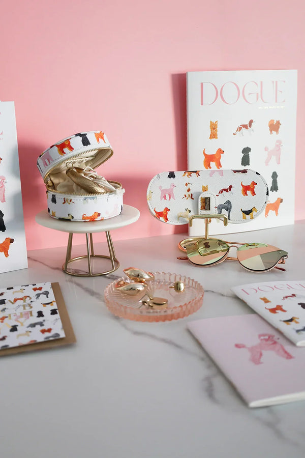Dogue eyewear case and round jewelry box with playful illustrated dogs