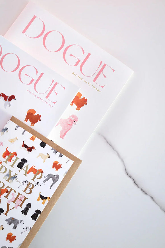 Dogue notebooks with dog illustrations and matching card on marble surface